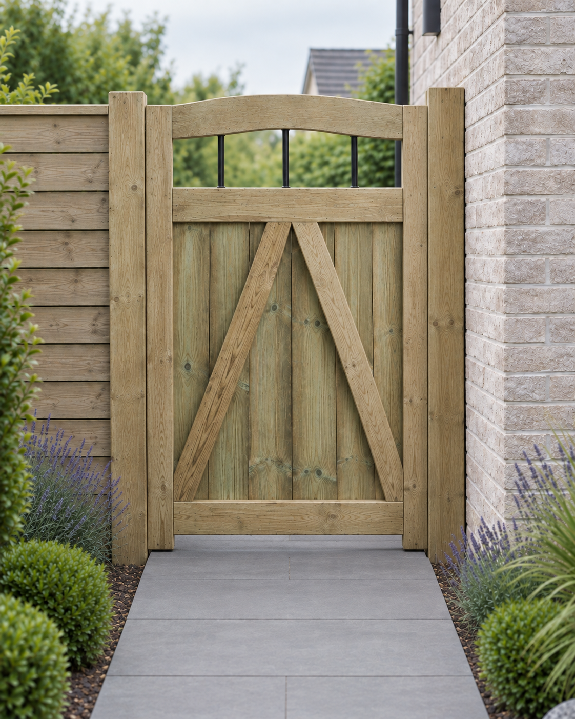 Rear of a tongue and groove dome top garden gate with black bars